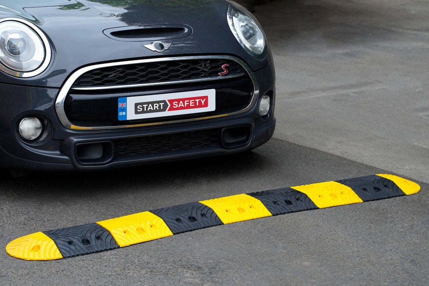 Top Stop Speed Bump On A Car Park
